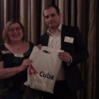 Ann Barber, Travel Counsellors receives a Cuba Tourist Office goody bag from Travel Bulletin?s Chris Gascoine